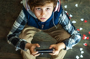 Kid with game controller in hands